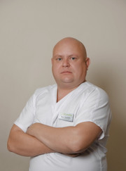 Имплантолог, стоматолог Илья Петрович Окунев